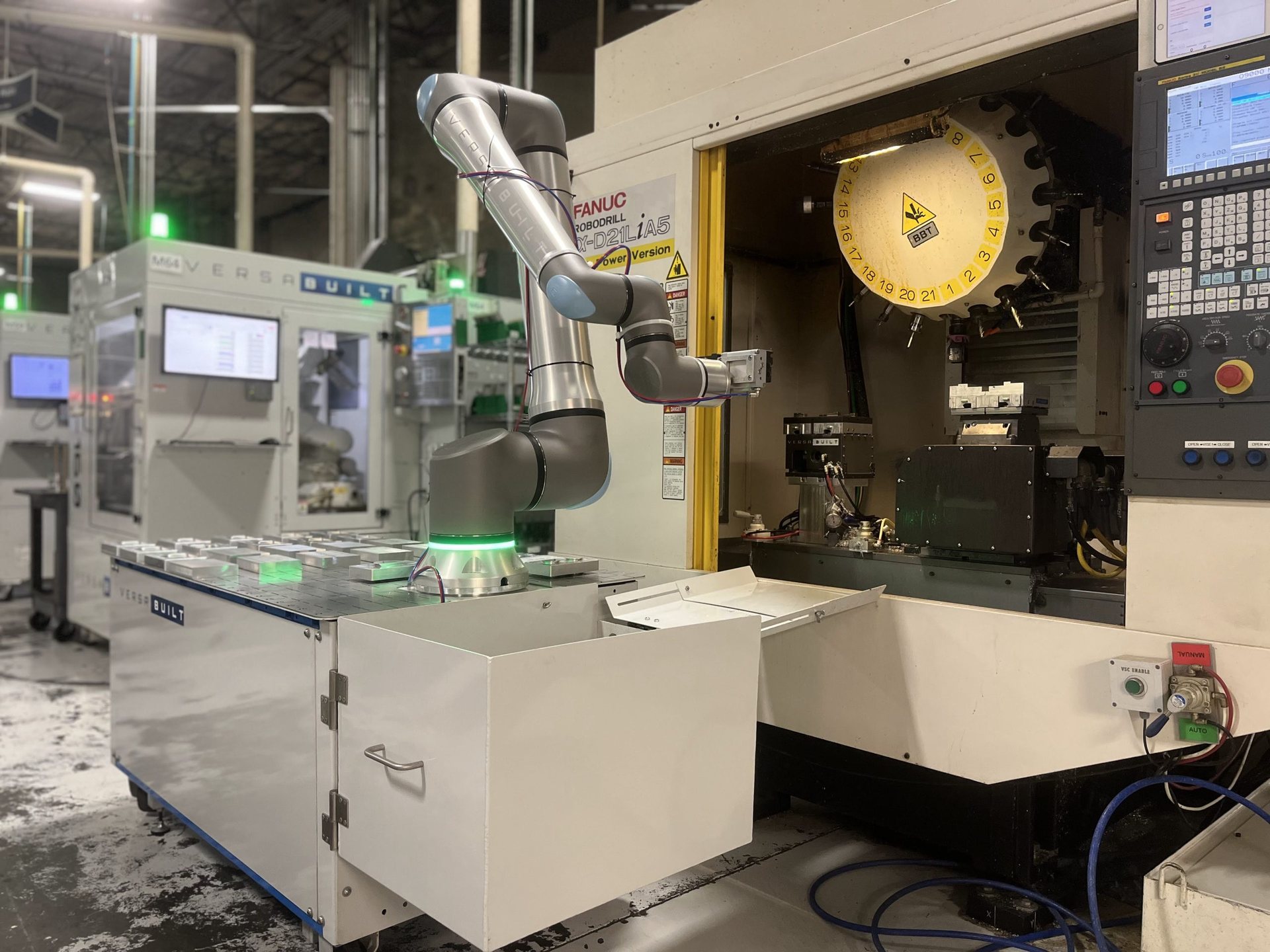 MultiGrip Mill Automation System installed beside a CNC mill